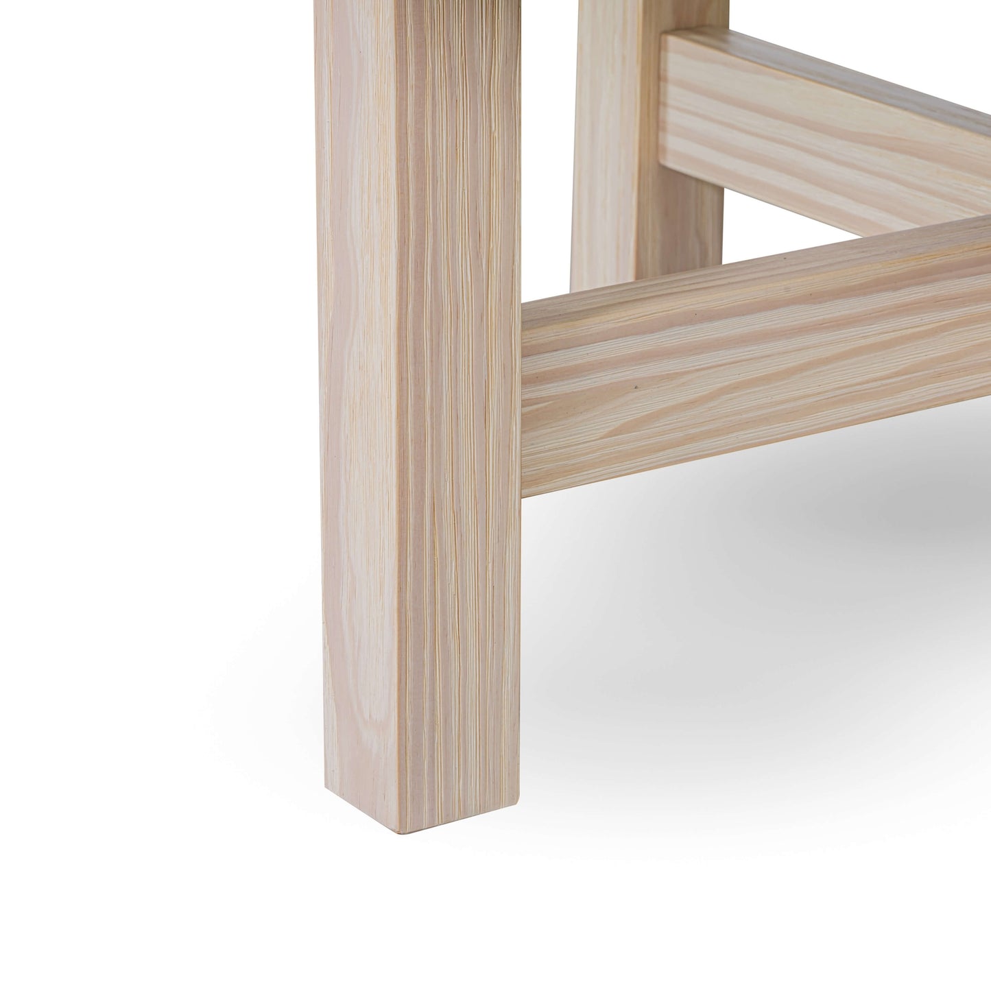 details of Helio Coffee Table wood legs in natural pine wood tone