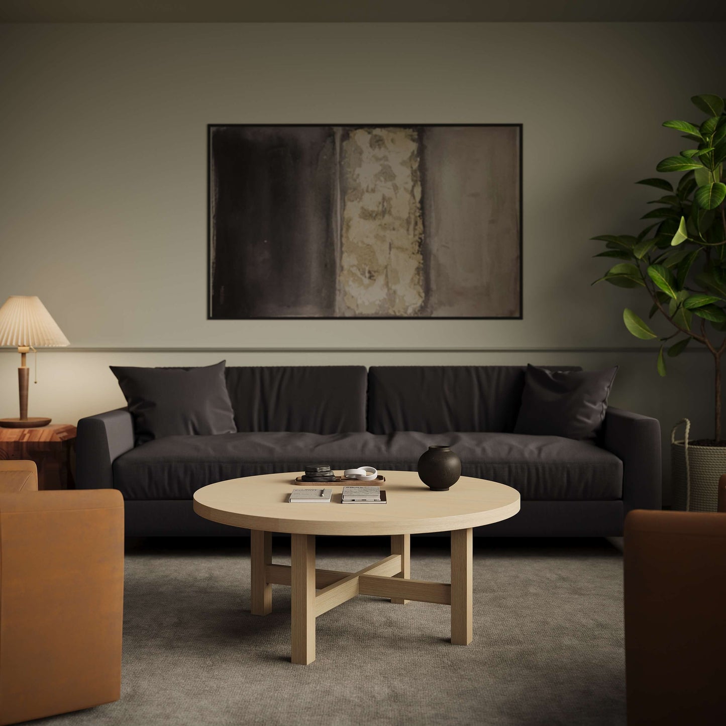 Cozy living room with dark sofa and a round natural wood coffee table on a neutral rug.