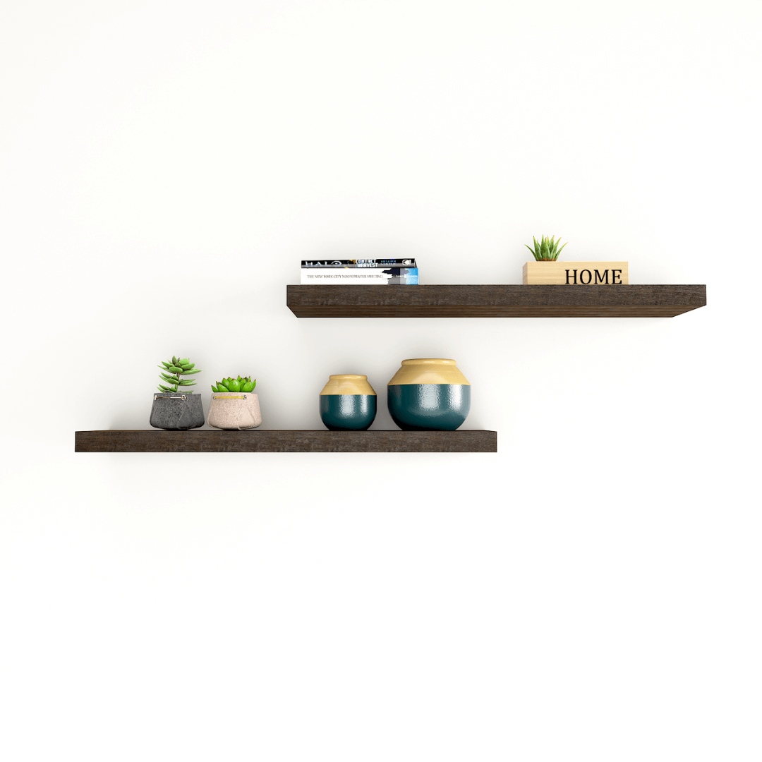 a set of 2 solid wood floating shelves hanging on the wall
